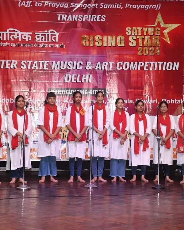 A group of our vocal students lined up on stage, ready to perform a choral piece at the "Satyug Rising Stars" competition. This is where practice turns into a confident performance.
