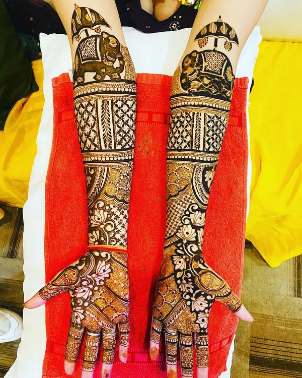 A full bridal mehndi design featuring majestic elephants on the forearms. In my advanced course, we focus on creating large-scale, symmetrical designs that are balanced and packed with detail.