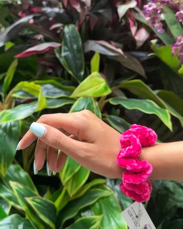 This vibrant pink velvet scrunchie is one of my favorites. The crochet technique gives it a unique, plush texture that's really comfortable to wear.