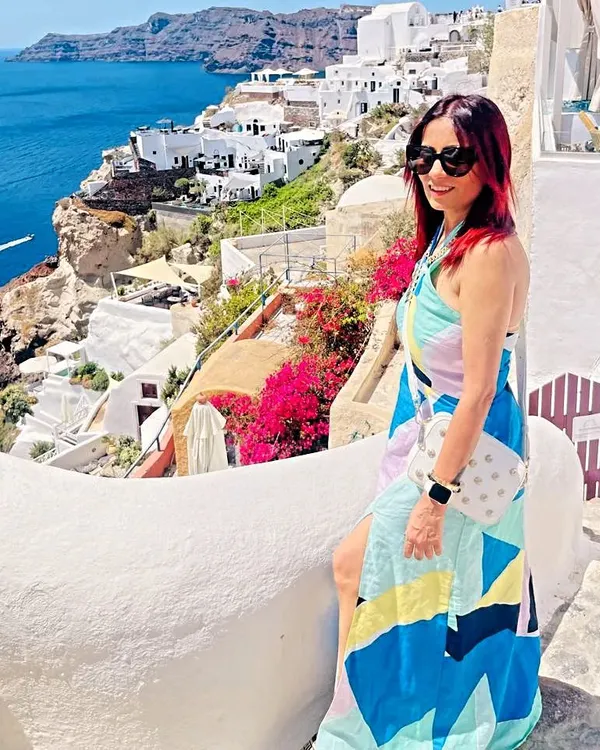 My fits are traveling the world! Here's a dress I designed for my client's lovely Greek vacation. The vibrant colors look stunning against the Santorini backdrop.