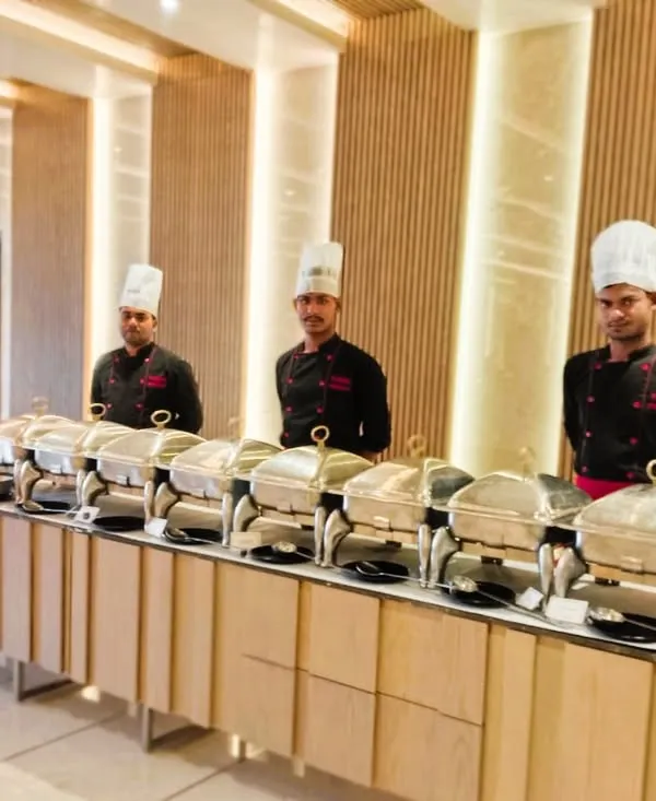 An elegant buffet setup for a dinner party at Prestige Primrose Hills. Our team ensures the catering looks as good as the beautiful venue.