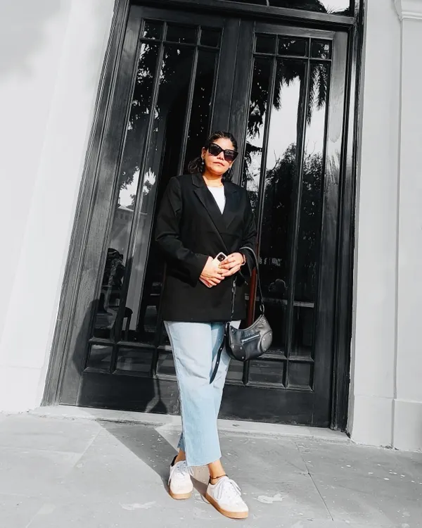 This is my go-to uniform for a reason. A classic black blazer over a white tee and light-wash jeans is a timeless combination that always looks polished. Paired with white sneakers, it's the perfect blend of smart and casual.