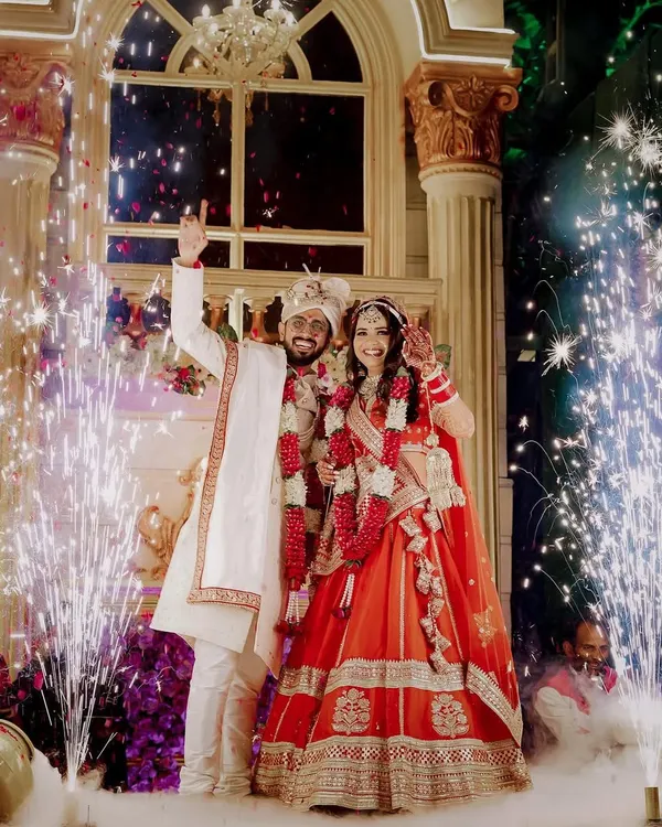 The Varmala ceremony is a highlight of any wedding, and I love capturing it with all the grandeur it deserves. The sparklers and smoke create a magical, celebratory atmosphere for the couple's big moment.