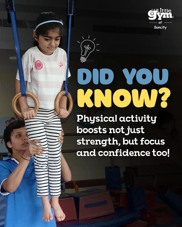 Physical activity boosts not just strength, but focus and confidence too. Here, a coach assists a grade-schooler on the rings, helping her build upper body and core strength.
