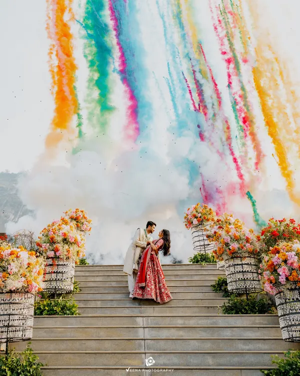 A truly explosive start to a new chapter. This engagement shot captures the couple against a backdrop of colorful smoke, a moment of pure joy and celebration that I meticulously planned and executed.
