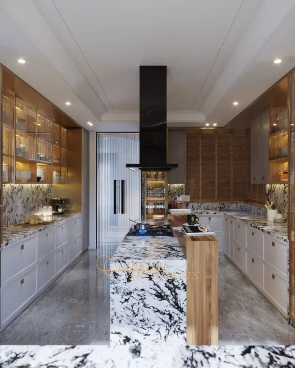 This gourmet kitchen combines bold design with practical function. The dramatic marble island serves as the centerpiece, complemented by custom cabinetry with integrated lighting and a layout planned for an intuitive culinary workflow.