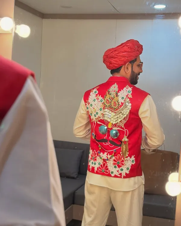 The back of this red Rajasthani-style vest features an incredibly detailed, handcrafted design. It's these unique details that make an outfit stand out on stage.
