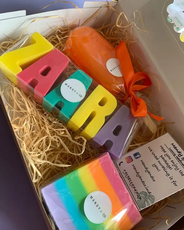 A vibrant, personalized gift box featuring a rainbow name soap for 'Zara', a colorful popsicle soap, and a rainbow bar. This is the kind of joyful, custom creation that makes gifting memorable.