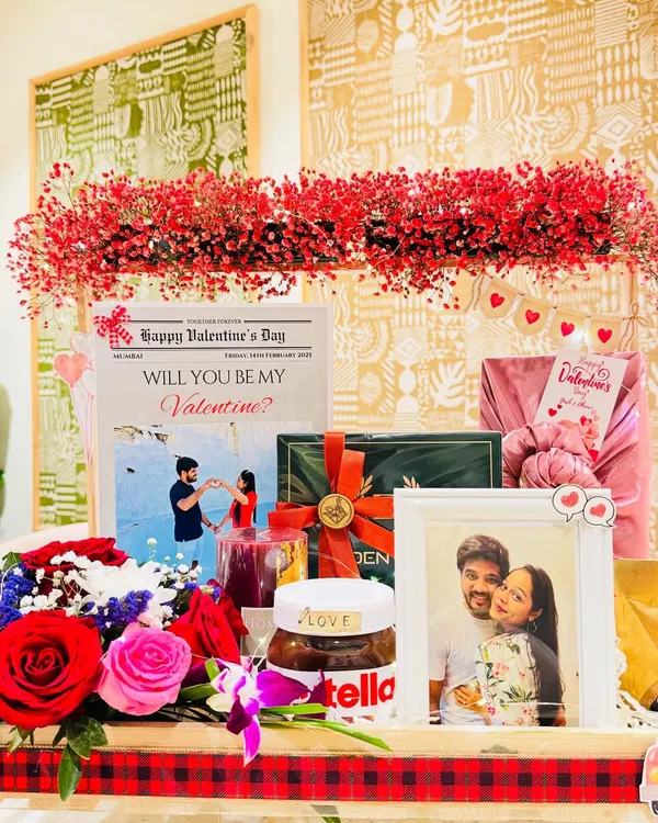This is more than a gift, it's a grand romantic gesture. I designed this Valentine's hamper for him with a stunning arch of red gypsy flowers, a personalized 'love newspaper' sharing their story, and a curated selection of grooming essentials and gourmet treats.
