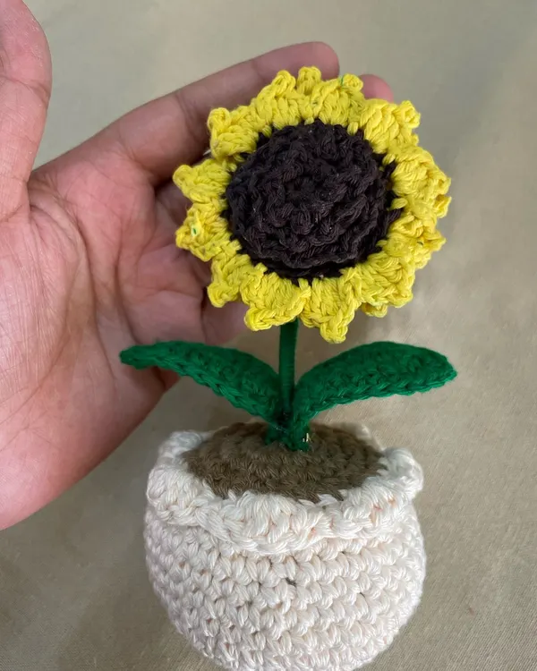 A close-up of my handmade crochet sunflower. I designed this to be a symbol of loyalty and happiness. It’s a perfect little gift to tell someone "I'll stay," and it will never wilt.
