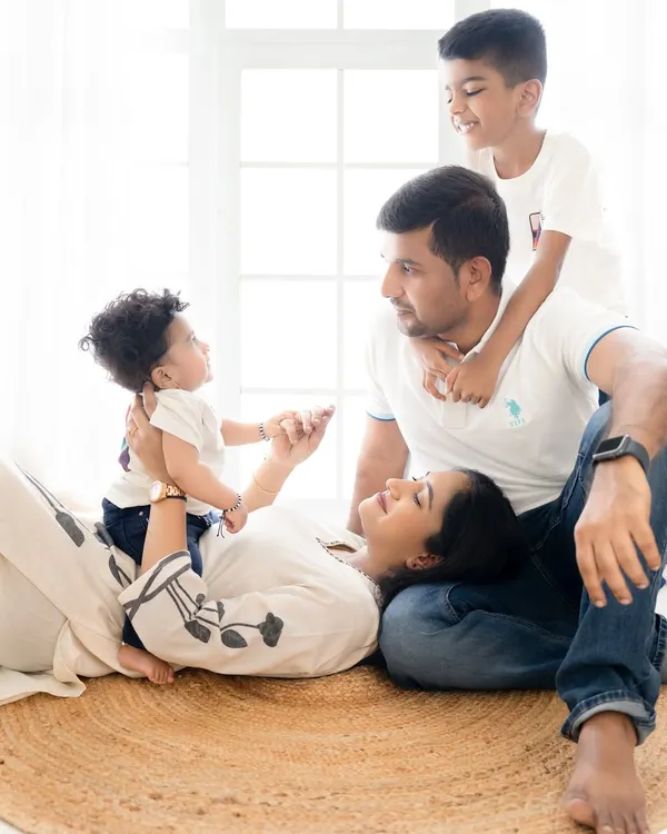 A candid moment from a beautiful family photoshoot in Bangalore. It's these unposed, playful interactions that truly capture the love and connection you share.