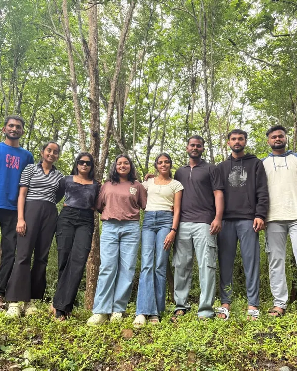 A happy group of adventurers posing for a photo in the forest. Our trips are a great way to meet like-minded people.