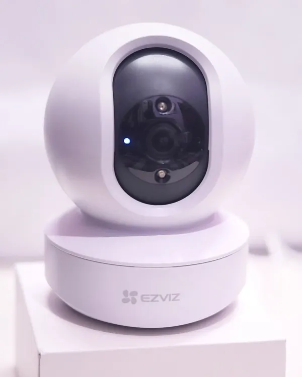 The EZVIZ TY1 Smart Home Camera, shown here with its power indicator on. This model offers 360 degree visual coverage with motorized pan and tilt, all controllable from your smartphone.
