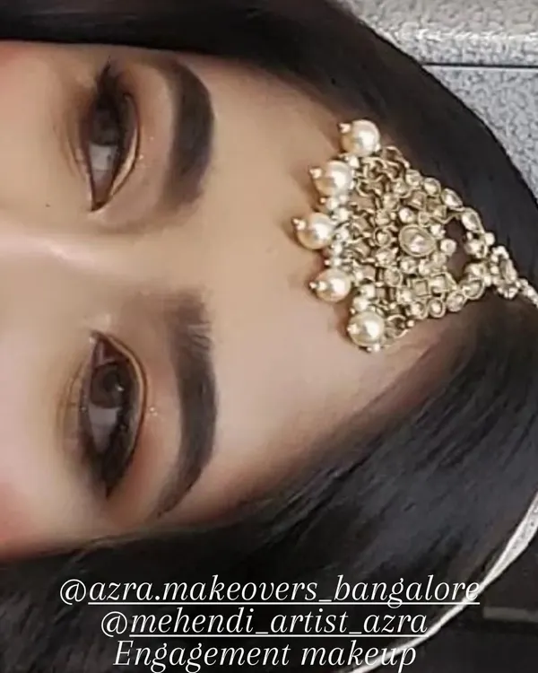 This is a close-up of my signature engagement eye makeup. The look is created with neutral tones, a soft brown smokey effect, and sharp eyeliner to define the eyes beautifully.