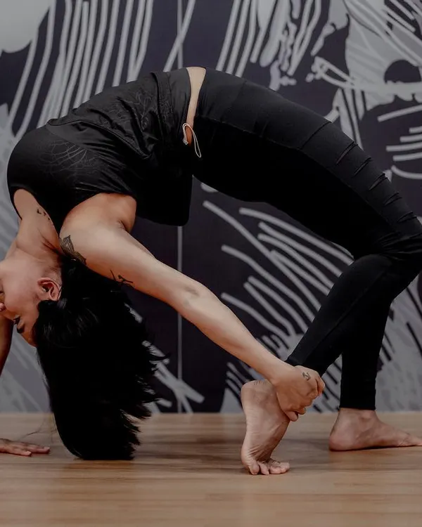 Urdhva Dhanurasana, or Wheel Pose, is a powerful heart opener that increases flexibility in the spine. This asana strengthens the entire body and is known to create a feeling of exhilaration and joy.