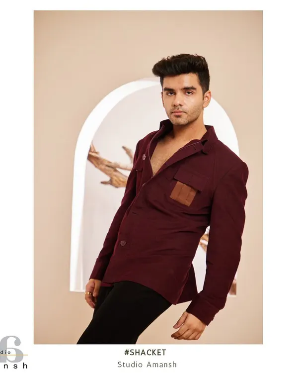 Our maroon shacket, a perfect blend of sophistication and laid-back style. This full-length shot shows its modern cut and how it can be worn for a sharp yet relaxed look.