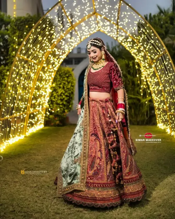 This stunning bridal lehenga, with its rich maroon velvet and intricate embroidery, is available to rent for your special day. I ensure every bride feels like royalty without the stress of a huge expense.