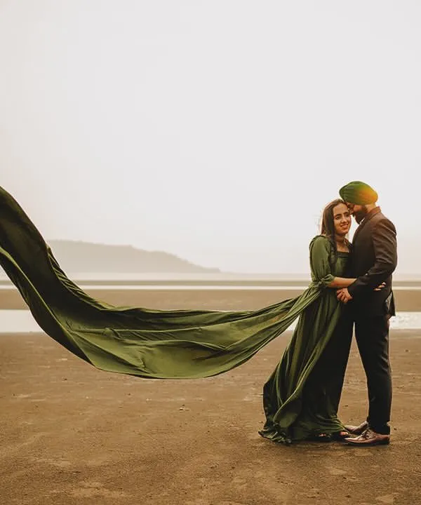 This is what it looks like when love meets the sea breeze. We created this dramatic, flowing gown shot in Alibaug to capture a feeling of timeless romance against the vastness of the beach.