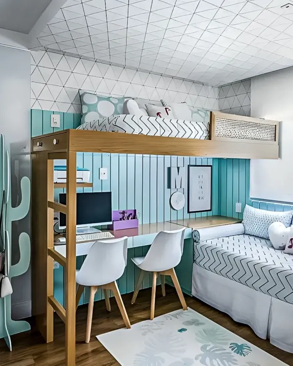 A perfect example of a shared kids' room that maximizes space. This loft bed design includes a desk for two underneath, creating separate study areas while leaving floor space for play.