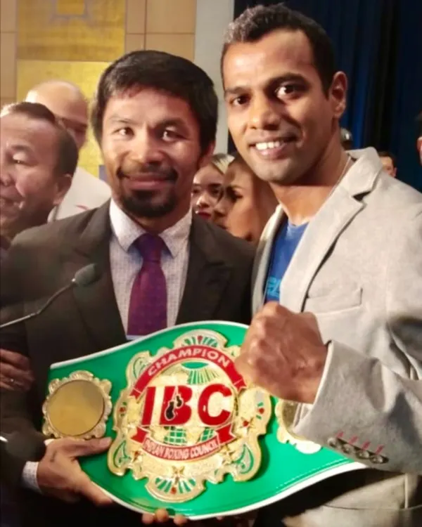 A moment of pride. Standing with the legendary 8-division world champion Manny Pacquiao after becoming the National Title Champion. I bring this world-class experience to my students.