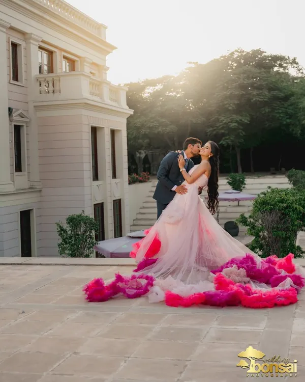 This is the kind of magic I love to create. A grand location, perfect golden hour light, and a couple completely lost in their moment. This shot captures the epic, fairytale romance that a pre-wedding film can bring to life.