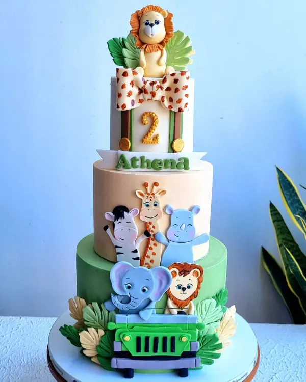 This three-tiered safari cake is full of playful, hand-sculpted fondant animals. I teach how to model cute characters like the lion, elephant, and zebra, and how to create details like the jeep and the giraffe-print bow.