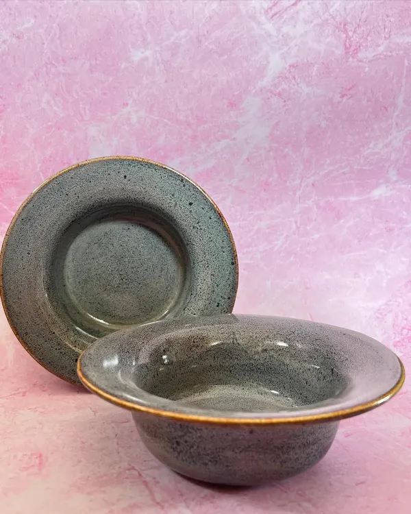 These stoneware pasta bowls are one of my most requested items. They have a wide rim that is perfect for catching sauce, and the speckled gray glaze is understated and elegant.