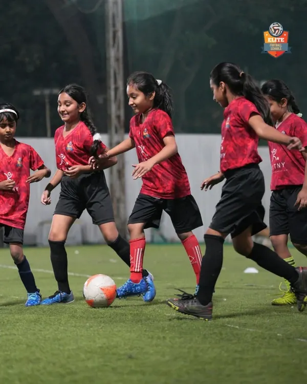 An action shot from one of our girls' football tournaments. We focus on creating high-energy, competitive matches for all our female athletes.