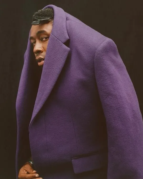 This is an example of my avant-garde and conceptual work. The unconventional styling of this purple tweed coat challenges traditional menswear norms, positioning it as a piece of wearable art and showcasing my creative direction in trend-setting fashion.