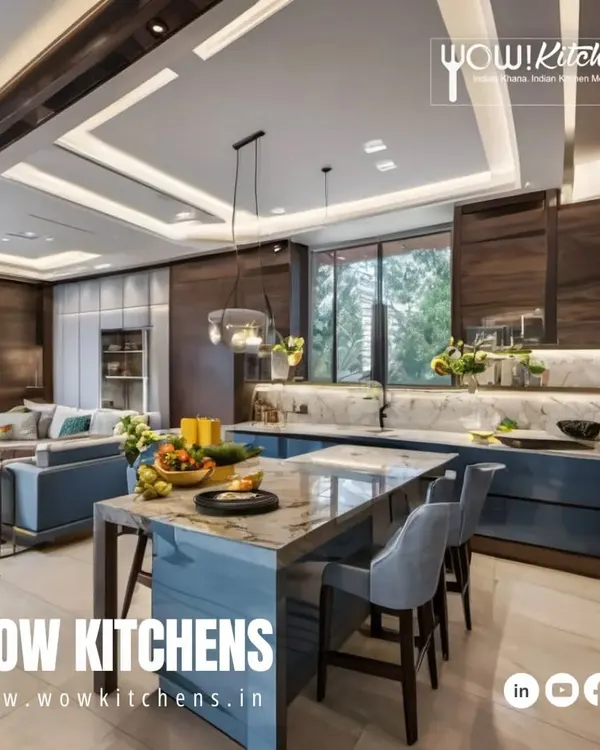 This is where luxury meets functionality. An expansive open-plan kitchen featuring a blue island with a marble waterfall countertop, seamlessly integrating with the living area for the ultimate entertainment space.