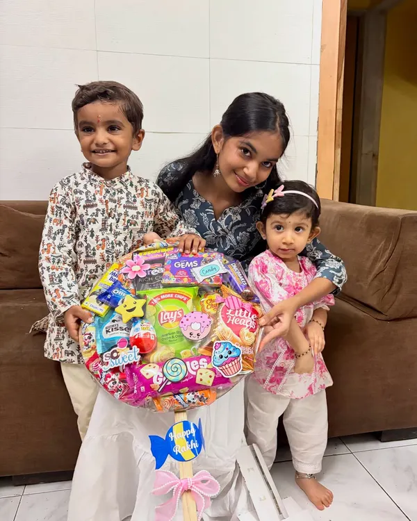 Seeing the smiles on these little faces is why I pour my heart into every creation. This giant lollipop hamper, filled with their favorite treats, was made for a special Rakhi celebration.