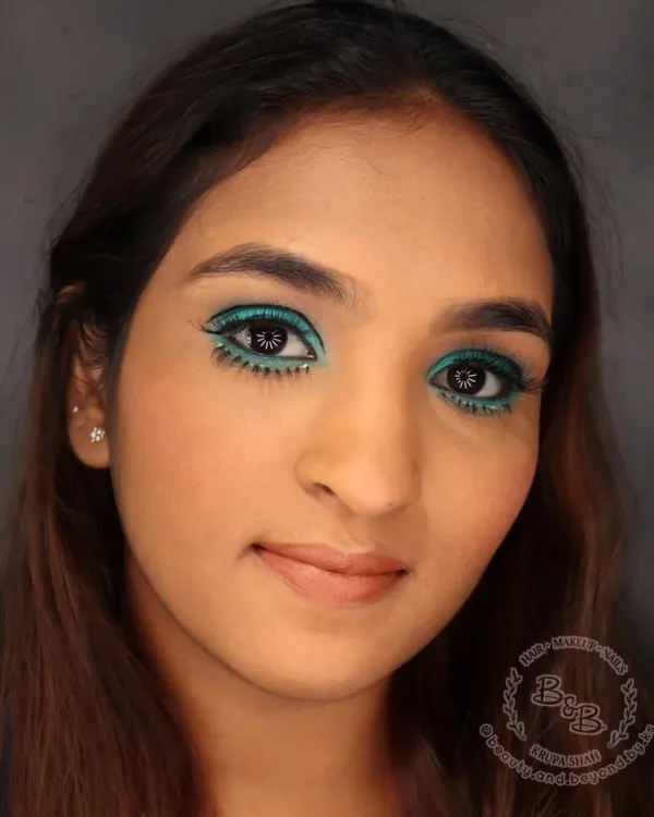 This is my modern interpretation of the iconic 1960s Twiggy look, perfect for a fashion editorial or a themed event. I created a sharp, graphic cut-crease with a vibrant teal and added the signature drawn-on lower lashes for that authentic retro vibe. It’s a look that’s both playful and powerful.