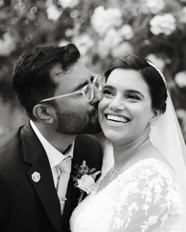 A pure, unscripted moment of joy. This is what it's all about for me. Capturing the laughter and love between a couple, in a way that feels completely natural and true to them. This black and white candid shot highlights the genuine connection that makes wedding photography so special.