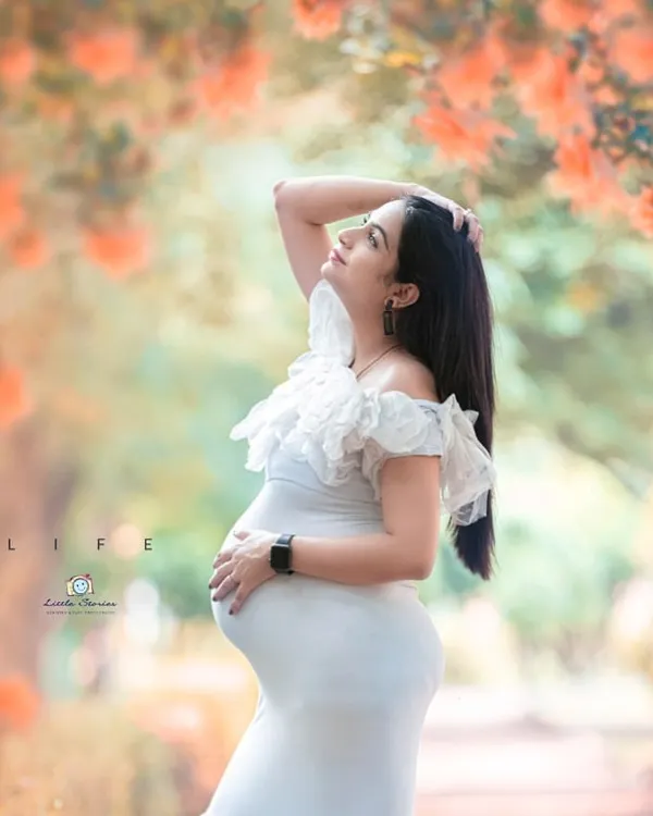 This is the kind of magical, light-filled portrait I love to create. We found the perfect natural frame in this garden to highlight her beautiful silhouette in one of my favorite white tulle gowns.
