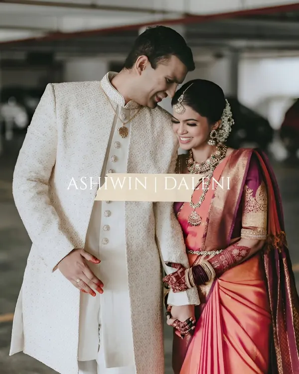 The joy of a South Indian wedding is radiant and infectious. Here, the groom in his classic sherwani and the bride in her vibrant Kanjeevaram saree share a laugh. This photo captures the blend of rich tradition and modern love that makes each wedding unique.
