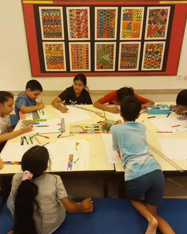 Serious drawing in progress! Here, my 8 to 15-year-old students are working on creating a 3D city, focusing on perspective and detailed line work.