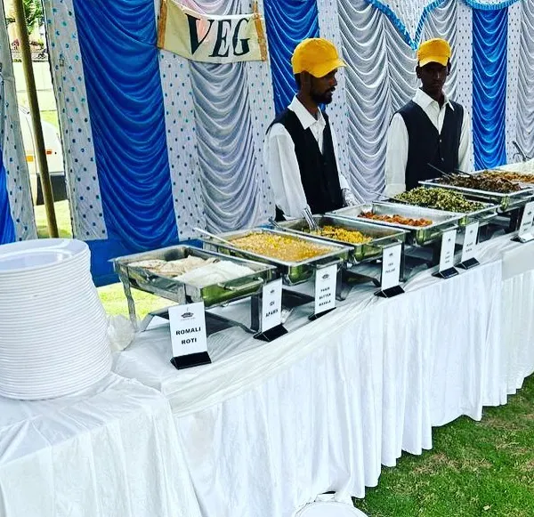 Our dedicated vegetarian buffet counter at an outdoor event. We offer a wide range of delicious veg dishes, from dal makhani to paneer preparations, all clearly labeled and served by our professional staff.