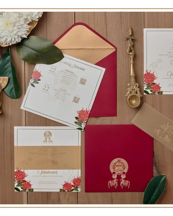 This invitation suite was created to represent the coming together of two South Indian cultures, Kerala and Karnataka. We used a rich red and gold palette and incorporated custom-illustrated motifs like Kathakali masks and temple elephants.