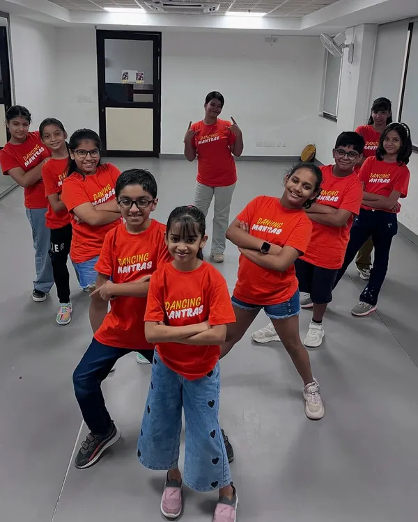 Our junior crew striking a pose in their red Dancing Mantras t-shirts. This is our kids' batch, full of energy and ready to learn some new moves in the studio.