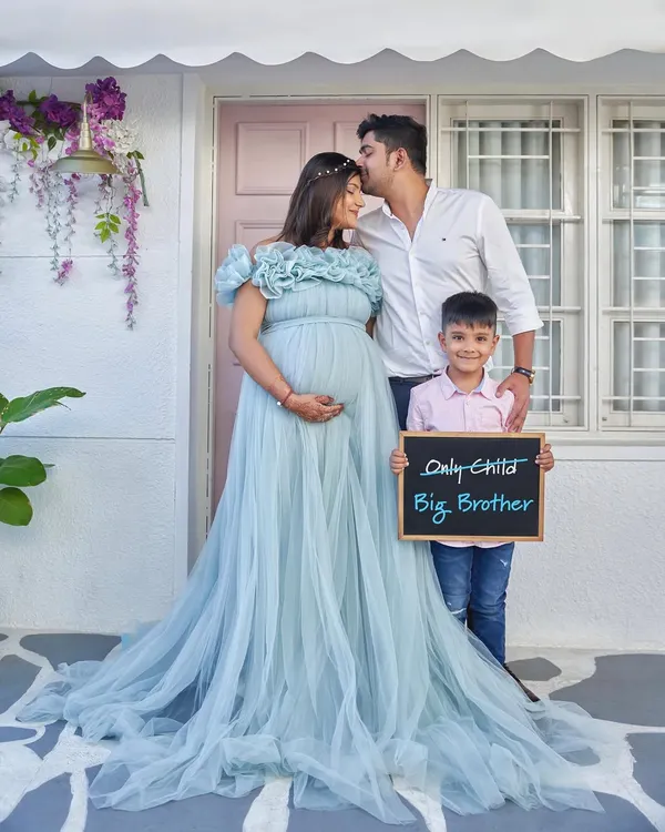 The perfect family announcement. Our flowy Elsa gown provides plenty of room for a soon-to-be big brother to join the photo.