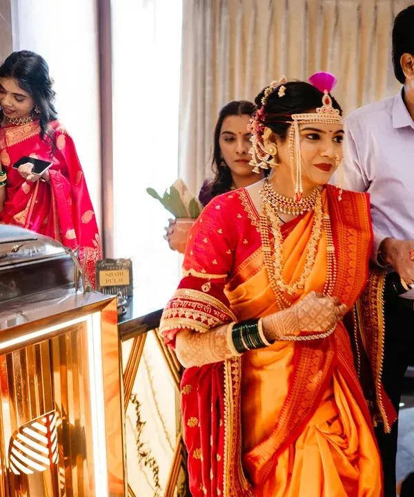 As the bride walks out, her mother is overcome with emotion in the background. These are the split-second, layered moments I look for, telling multiple stories in a single frame.