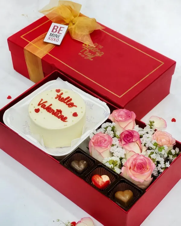 My ultimate Valentine's Day hamper. This beautiful red box includes a "Hello Valentine" bento cake, a bouquet of fresh roses, and a selection of my heart-shaped couverture bonbons.