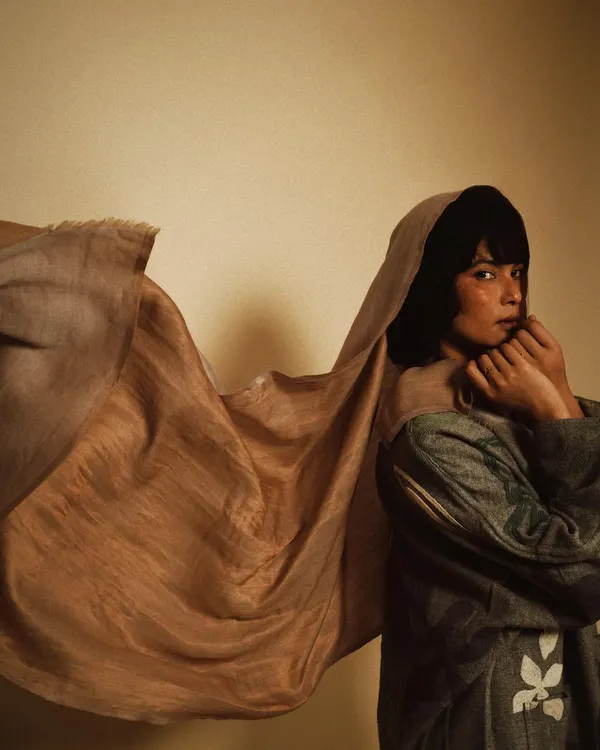A portrait that captures the beautiful texture and movement of eri silk. This studio shoot for Wandering Silk was about letting the fabric tell its own story, creating a soft and soulful image.