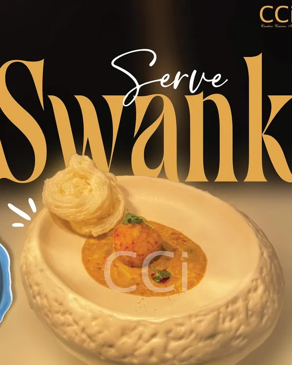 We serve swank. This artfully plated dish, featuring a delicate nest-like garnish, embodies our commitment to redefining taste with style and elegance.