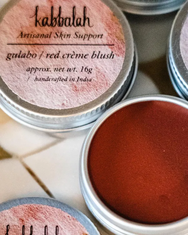 A close-up of my 'Gulabo' red crème blush, a multi-use tint for lips and cheeks. The rich color comes from natural red clay, providing a beautiful flush without any synthetic dyes.