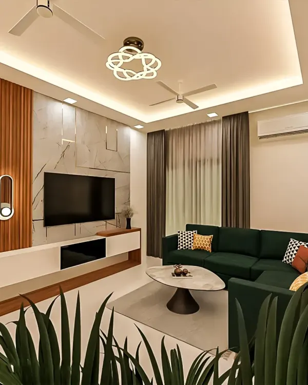 We designed this modern living room to be a perfect blend of comfort and style. The deep green sectional sofa provides ample seating, while the combination of a marble-effect feature wall, wood fluting, and strategic cove lighting creates a warm and sophisticated ambiance for relaxation and entertainment.