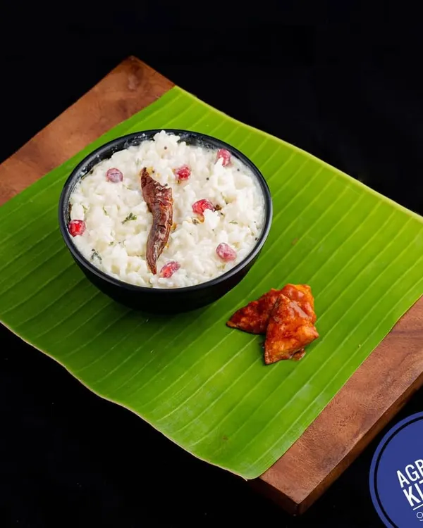 The perfect end to any South Indian meal, my Curd Rice. It's tempered with spices and garnished with pomegranate seeds, served here traditionally on a banana leaf with a side of pickle.