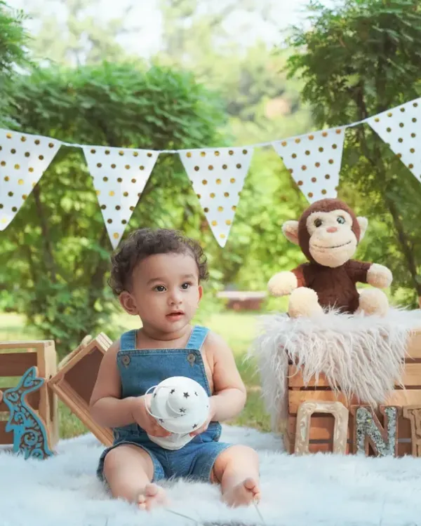 A beautiful outdoor first birthday setup in a park. We bring the props to create a special scene for your baby's milestone celebration.