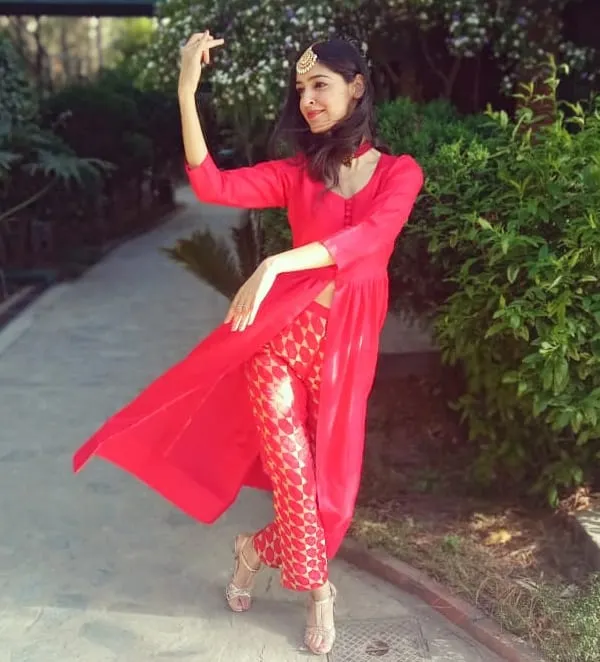 A candid moment, striking a dance pose in a beautiful garden. I find that the impulse to dance can appear anywhere, bringing a little bit of magic to an ordinary day.