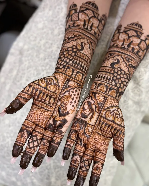 This is the kind of detailed work I love doing for engagements. This design features a full portrait of the couple, surrounded by intricate patterns, elephants, and peacocks, extending up the arm. It's a beautiful way to tell your story.